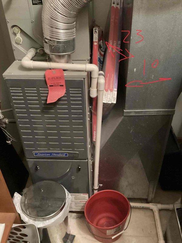 Provided comprehensive estimate for complete HVAC system replacement in condo utility room, including tankless water heater, furnace, and air conditioning unit. Assessed existing American Standard furnace installation with associated ductwork, refrigerant lines, condensate drainage system, and electrical connections. Documented current equipment configuration, measured ductwork dimensions, and photographed mechanical room layout to develop accurate replacement specifications for new high-efficiency heating and cooling system.