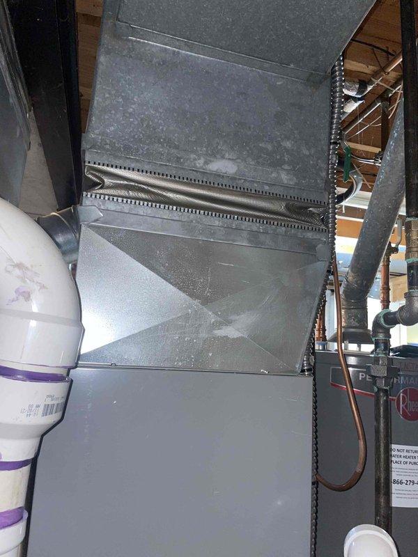 Completed routine AC tune-up maintenance on basement air conditioning system of unknown age with no reported issues. Performed standard preventive maintenance procedures including inspection of ductwork, refrigerant lines, electrical connections, and associated HVAC components. System found in operational condition with typical dust accumulation on ductwork and surrounding equipment consistent with normal use.
