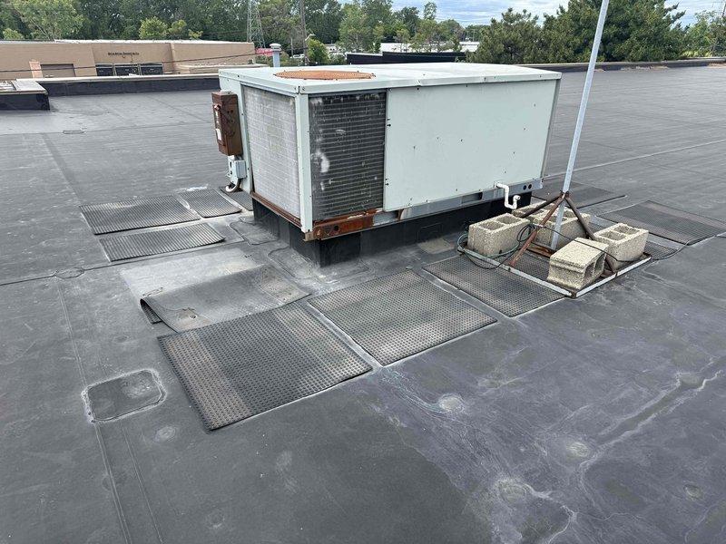 Performed routine maintenance service on rooftop commercial air conditioning unit #41. Inspected unit operation, verified proper function of all components, and documented equipment condition with photos showing unit mounted on designated walkway pads with appropriate safety access infrastructure in place.