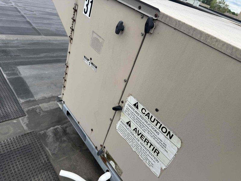 Performed routine maintenance service on rooftop commercial air conditioning unit #41. Inspected unit operation, verified proper function of all components, and documented equipment condition with photos showing unit mounted on designated walkway pads with appropriate safety access infrastructure in place.