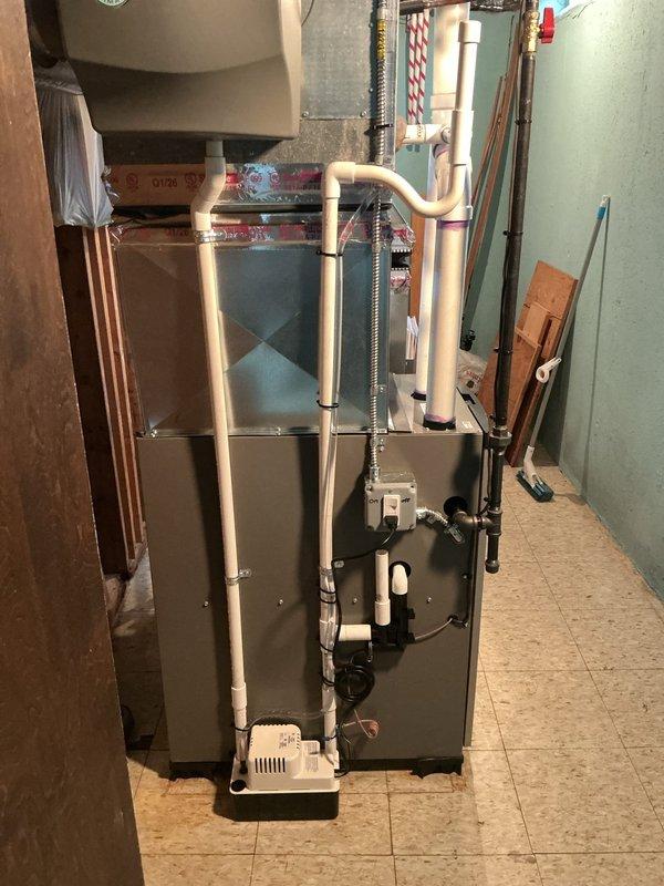 Responded to City of Warren mechanical violation for water leak issue. Corrected kinked vinyl condensate drain line that was restricting proper drainage flow. Installed float switch safety device on condensate pump to prevent water overflow into wall cavity as reported by property owner. Verified pump operation and proper drainage discharge. Labeled furnace disconnect switch with ON/OFF identification for code compliance and safety requirements. System tested and confirmed operational with no active leaks present.