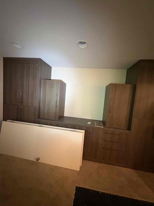 Completed comprehensive whole home electrical inspection for recently purchased residential property. Conducted thorough evaluation of all electrical systems, fixtures, outlets, switches, and circuit panels throughout the dwelling. Inspected bedroom/office area with built-in cabinetry, verifying proper operation of recessed lighting fixtures and wall outlets. Examined bathroom electrical components including ceiling-mounted fixtures and HVAC ventilation systems to ensure compliance with safety standards and proper grounding. All accessible electrical components were tested for functionality and code compliance. Provided detailed findings to homeowner regarding the overall condition of the electrical system.