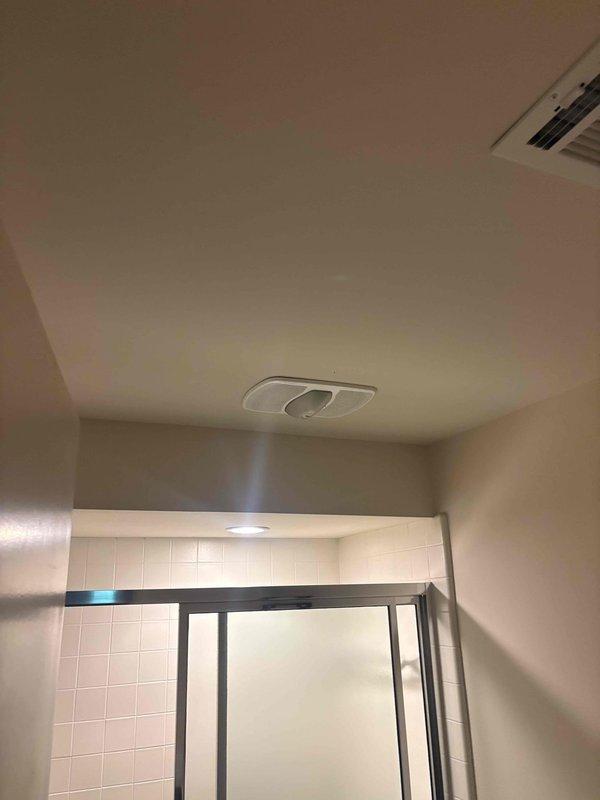 Completed comprehensive whole home electrical inspection for recently purchased residential property. Conducted thorough evaluation of all electrical systems, fixtures, outlets, switches, and circuit panels throughout the dwelling. Inspected bedroom/office area with built-in cabinetry, verifying proper operation of recessed lighting fixtures and wall outlets. Examined bathroom electrical components including ceiling-mounted fixtures and HVAC ventilation systems to ensure compliance with safety standards and proper grounding. All accessible electrical components were tested for functionality and code compliance. Provided detailed findings to homeowner regarding the overall condition of the electrical system.