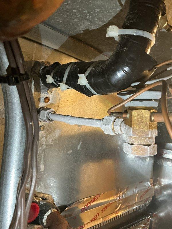 Completed routine cooling maintenance and tune-up on Bryant air conditioning system. Performed comprehensive inspection of outdoor condensing unit with Quantum Coil technology, verified proper operation of condenser fan and protective guard, and checked refrigerant line connections. Inspected indoor mechanical components including piping connections, brass valves, and insulation integrity. System tested and confirmed operating properly with no issues identified.