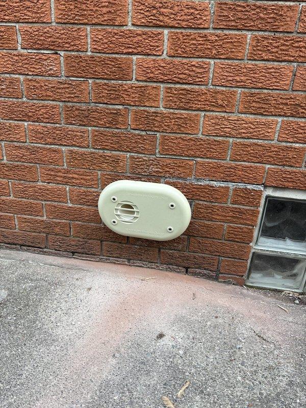 Completed callback to install low-profile exhaust vent kit on exterior brick wall for improved aesthetics and customer satisfaction. Inspected condensate pump system for reported water leak concerns, verified proper drainage operation, and confirmed secure mounting of discharge piping along exterior wall structure. All components functioning properly with no active leaks detected at time of inspection.