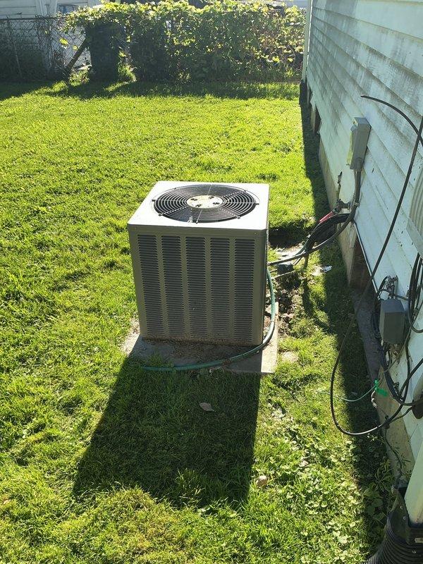 Responded to no-cooling complaint where air was blowing from vents but not cold. Performed diagnostic evaluation of split system air conditioning unit, inspecting outdoor condenser unit in backyard and indoor air handler/furnace in basement. Conducted visual inspection of both components, checked electrical connections, and assessed overall system condition. Completed diagnostic service call and documented equipment with photos for customer records.