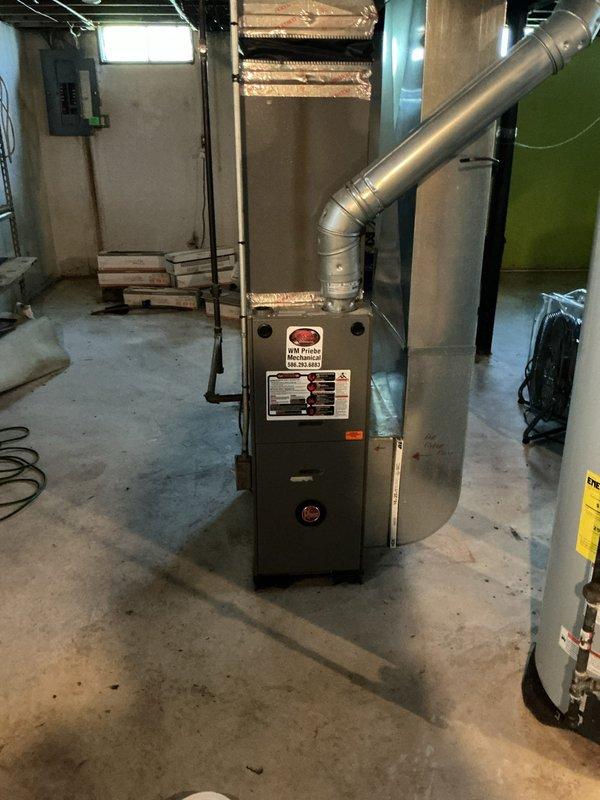 Responded to no-cooling complaint where air was blowing from vents but not cold. Performed diagnostic evaluation of split system air conditioning unit, inspecting outdoor condenser unit in backyard and indoor air handler/furnace in basement. Conducted visual inspection of both components, checked electrical connections, and assessed overall system condition. Completed diagnostic service call and documented equipment with photos for customer records.