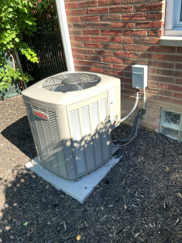 Completed comprehensive cooling system replacement estimate for a medium-sized residential property (1500-3000 sq.ft.) with basement unit location. Assessed existing Lennox outdoor condenser unit positioned on concrete pad against brick exterior wall, noting current equipment condition, electrical disconnect box, refrigerant line routing, and proper installation clearances. Recommended vertical upflow/downflow A/C coil configuration compatible with existing infrastructure and provided detailed replacement system specifications for complete cooling system upgrade.