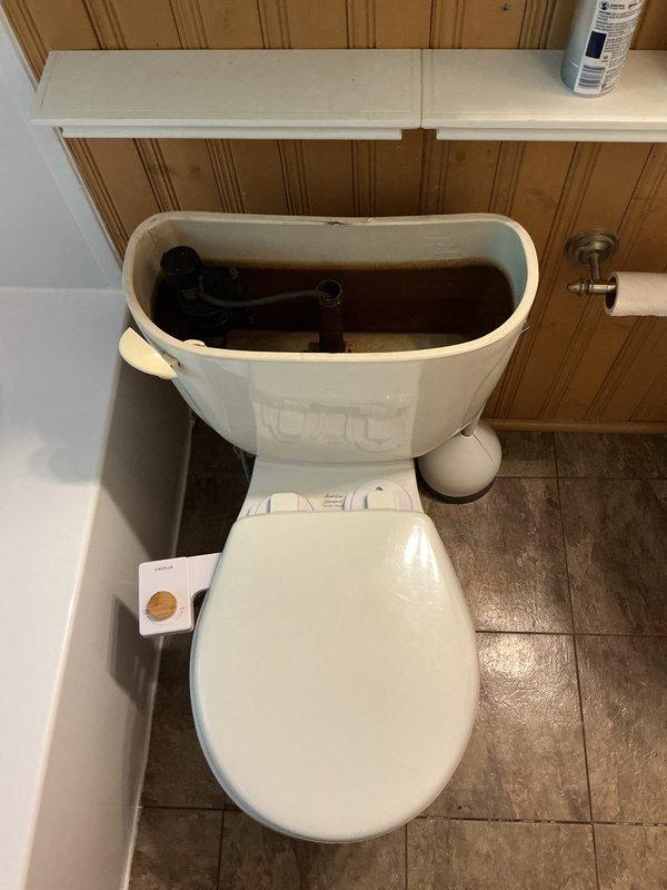 Responded to service call for toilet that would not drain and was overflowing. Upon inspection, removed tank lid to diagnose drainage issue and assessed internal flush mechanisms and components. Addressed the blockage causing the overflow condition, restored proper drainage function, and verified toilet was operating correctly with no further overflow issues.