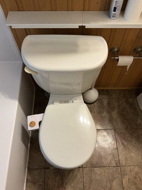 Responded to service call for toilet that would not drain and was overflowing. Upon inspection, removed tank lid to diagnose drainage issue and assessed internal flush mechanisms and components. Addressed the blockage causing the overflow condition, restored proper drainage function, and verified toilet was operating correctly with no further overflow issues.