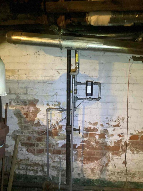 Provided comprehensive estimate for complete ductwork replacement serving upstairs natural gas furnace system. Assessed existing deteriorated ductwork installation in basement and attic spaces, noting compromised metallic ductwork with inadequate insulation and inefficient routing through confined crawl space. Evaluated current HVAC air handler unit located in attic area with black flexible ductwork requiring replacement due to age and performance concerns. Documented extensive ductwork layout including vertical chase runs, horizontal distribution systems, and connection points to existing gas furnace equipment. Recommended full ductwork system redesign to improve airflow efficiency, reduce energy loss, and enhance overall HVAC system performance throughout home.