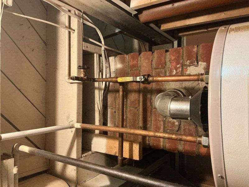 Responded to service call for squeaking noise from outdoor air conditioning condenser unit. Upon arrival, inspected 13-year-old AC system and performed diagnostic assessment of outdoor unit components. Conducted visual inspection of condenser unit, examining fan motor, bearings, and mechanical components to identify source of squeaking noise. Evaluated system operation and confirmed cooling performance remained unaffected. Documented equipment condition with photographs of outdoor condenser unit and related HVAC infrastructure. Unit found to be operating with adequate cooling capacity despite audible noise concern.