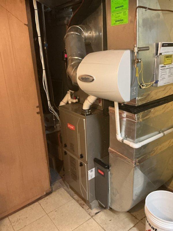 Completed comprehensive Gold AC inspection on 7-year-old Bryant HVAC system located in basement. Performed full system evaluation including visual inspection of furnace, air handler, ductwork connections, and associated components. Verified proper operation of all equipment, checked refrigerant lines, electrical connections, and mounting integrity. System found to be in good working condition with all components functioning as designed.