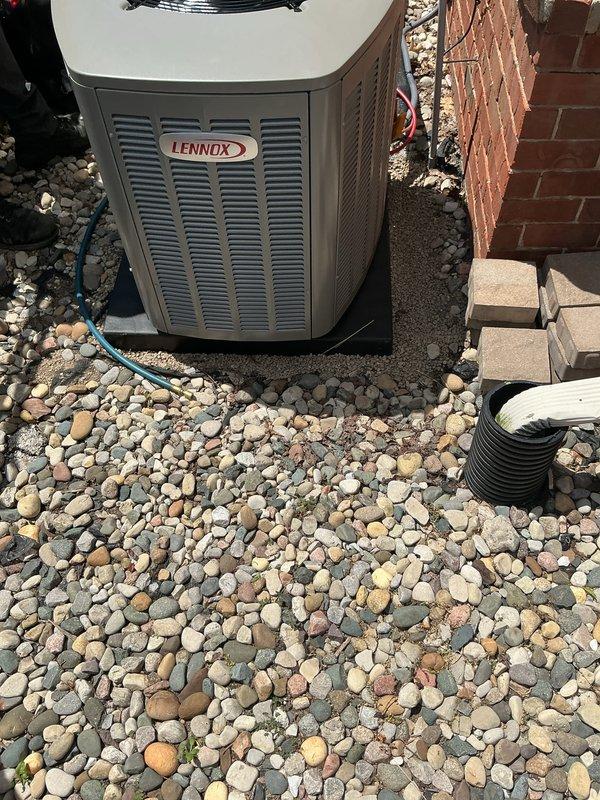 Completed installation of 2.5 ton Lennox air conditioning system with new evaporator coil in left side yard location. System was positioned on river rock base adjacent to brick wall exterior, with all refrigerant lines properly connected to existing Bryant furnace system in interior utility room. Obtained mechanical, electrical, and air conditioning permits, performed system flush, verified all connections, and successfully reconnected complete HVAC system to operational status.