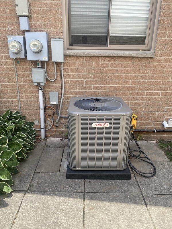 Successfully completed installation of a 2.5-ton Lennox air conditioning system with matching evaporator coil on the left side of the residence. The outdoor condenser unit was positioned on a platform pad with proper electrical connections, while the indoor air handler and coil were installed in the mechanical room with new ductwork, PVC condensate lines, and electrical conduit properly routed and secured.