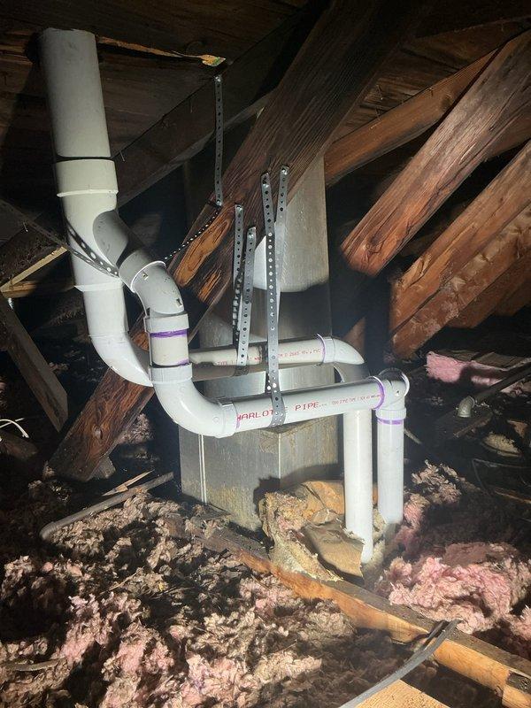Completed full HVAC system installation including a 45,000 BTU counterflow furnace and 2-ton air conditioning unit positioned in right side yard. Installed concentric venting system routed through attic space with proper PVC piping, secured with metal strapping to structural members. Set new thermostat, reconnected all electrical and mechanical connections, and verified system operation. Mechanical and electrical permits requested for furnace and AC installation, with utility rebate documentation submitted.