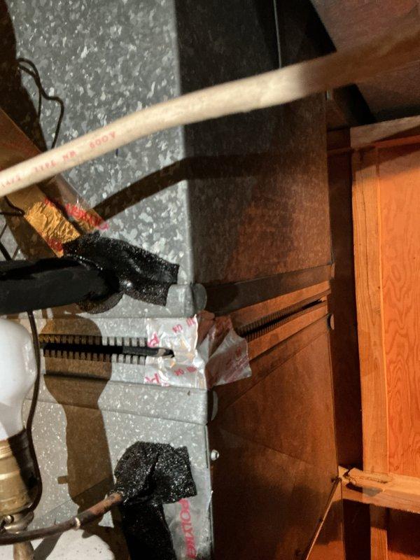 Responded to call regarding AC line freezing on operational cooling system. Upon arrival, confirmed R22 refrigerant system with low charge condition. Inspected outdoor condensing unit and indoor furnace/air handler located in basement. Documented existing HVAC equipment of unknown age with copper refrigerant lines showing signs of ice formation. Diagnosed low refrigerant charge as primary cause of freezing condition. Provided estimate for system replacement due to R22 refrigerant phase-out and age-related concerns of existing equipment.