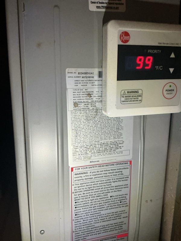 Responded to service call for Rheem tankless water heater (model EZOH200DVLKL2) displaying error code 99 with blinking display and no hot water delivery. Upon inspection, diagnosed system malfunction related to temperature sensor or control board issue causing false temperature reading. Performed troubleshooting procedures, reset unit controls, verified proper operation of circulator pump and plumbing connections, and restored hot water flow to system.