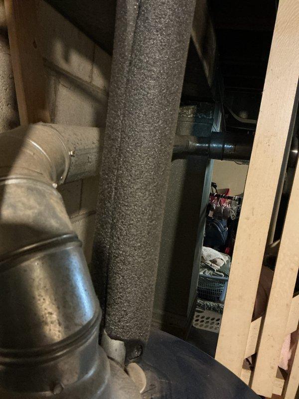 Conducted comprehensive evaluation of 30-year-old basement-installed heating and cooling system in small residential property (0-1500 sq.ft.) for full system replacement estimate. Assessed existing natural gas furnace, air conditioning unit, ductwork, and ventilation components showing significant age-related deterioration. Documented current equipment specifications, measured existing duct runs including flexible and rigid metal ductwork with insulated vertical runs, and evaluated basement installation space constraints for replacement equipment sizing and positioning.