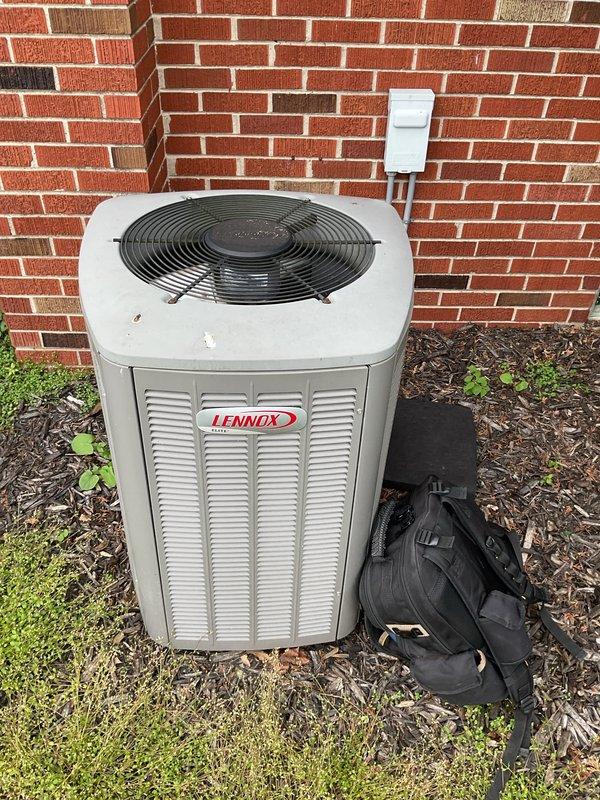 Completed comprehensive Gold AC Inspection and seasonal maintenance on an 18-year-old Lennox air conditioning condenser unit located outdoors. Performed full system evaluation including refrigerant charge verification, electrical component testing, condenser coil cleaning, and airflow assessment. Inspected outdoor unit cabinet, fan motor operation, compressor functionality, and all electrical connections. Verified proper operation of disconnect box and checked amperage draw on all components. Cleaned condenser coils and cleared debris from unit perimeter. System operating within normal parameters with no immediate concerns identified. Recommended continued monitoring due to age of equipment, as unit is approaching typical end-of-life expectancy for residential air conditioning systems.