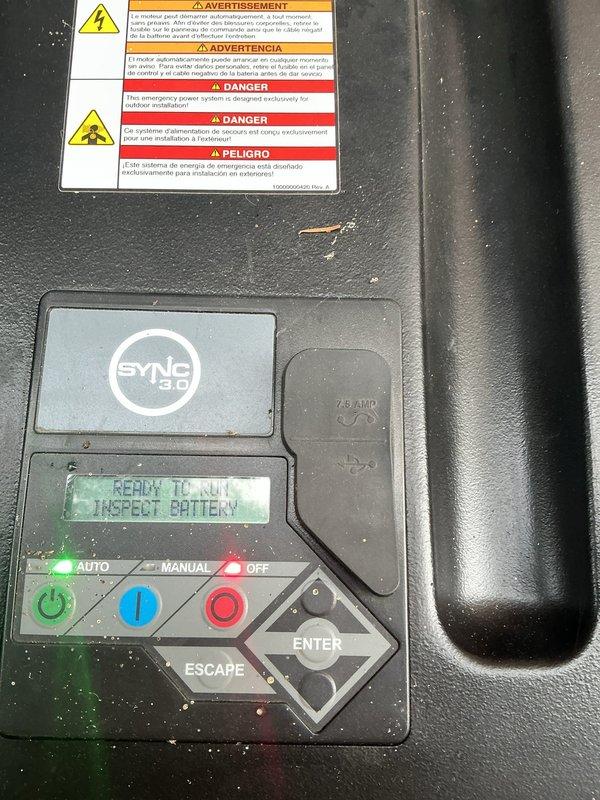 Responded to service call for 14KW Honeywell generator displaying "INSPECT BATTERY" message on control panel. Performed comprehensive battery diagnostic using load tester to verify battery condition and charging system performance. Upon testing, confirmed battery and charging system operating within normal parameters, with load test results indicating "good" range on 12-volt system. Cleared inspection alert from control panel, verified unit status returned to "READY TO RUN" mode with AUTO function enabled, and confirmed generator system fully operational with no further service required at this time.