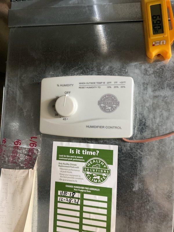 Completed routine air conditioner tune-up on 20-year-old system located at rear of property. Performed standard maintenance procedures including system inspection, refrigerant pressure check, and filter assessment. Documented existing humidifier control settings and observed 20x25x4 Honeywell filter in place during service visit.