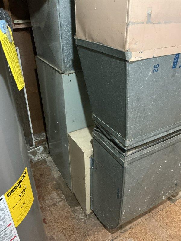 Conducted comprehensive evaluation of 10+ year old furnace system located in basement for pre-sale city certification and gas leak assessment. Inspected furnace cabinet, heat exchanger, burner assembly, gas valve, and all supply connections to identify source of reported gas leak. Examined ductwork connections, ventilation components, and overall system integrity. Documented equipment condition with detailed photographs showing furnace unit, ductwork configuration, and mechanical components. Provided estimate for necessary repairs to address gas leak and bring system into compliance with municipal safety standards required for property transfer certification.