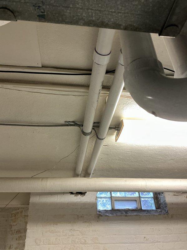 Completed full HVAC system installation including new furnace and air conditioning unit in basement utility area. Installed Ecobee 3 Lite smart thermostat for system control and programming. Ran new PVC condensate drain lines and venting, connecting to existing infrastructure with proper pitch and support. Performed pressure switch testing using digital manometer, verifying proper system pressures at 76.8 reading on both ports to ensure safe operation. Connected new ductwork with insulated trunk lines and flexible transitions. Secured all electrical connections and verified proper voltage supply. Submitted permit application and utility rebate paperwork for processing. System startup completed with all safety checks passed and equipment operating within manufacturer specifications.