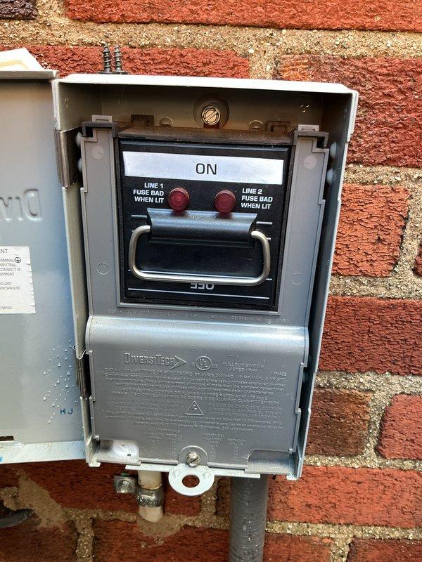 Completed Gold AC Inspection on two residential air conditioning systems - one 30-year-old unit located in basement and one unit of unknown age in attic space accessed through third-floor crawl entry. Performed comprehensive maintenance including filter inspection, refrigerant level checks, electrical connection testing, condensate drain evaluation, and airflow measurements on both systems. 

Basement unit inspection revealed aging copper refrigerant lines with significant green patina oxidation and corrosion buildup, indicating prolonged moisture exposure. Flexible ductwork showed heavy dust accumulation. Mineral deposits and debris observed on brass fittings and surrounding components. Documented deteriorated condition of 30-year-old system components with photographic evidence.

Exterior disconnect box inspected on basement system - verified proper operation of Inverter-Duty rated disconnect switch, confirmed both line fuses operational with indicator lights functioning correctly, i