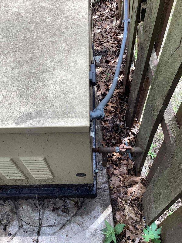 Conducted site evaluation for whole home generator replacement with Kohler brand equipment. Assessed existing generator installation location adjacent to building foundation, documenting current equipment positioning, conduit routing, and clearance requirements. Evaluated electrical service panel configuration and existing circuit breaker arrangement to determine integration requirements for new generator system. Photographed existing installation conditions including equipment access area, utility connections, and main electrical panel to develop accurate replacement specifications and ensure proper sizing for whole home backup power requirements.