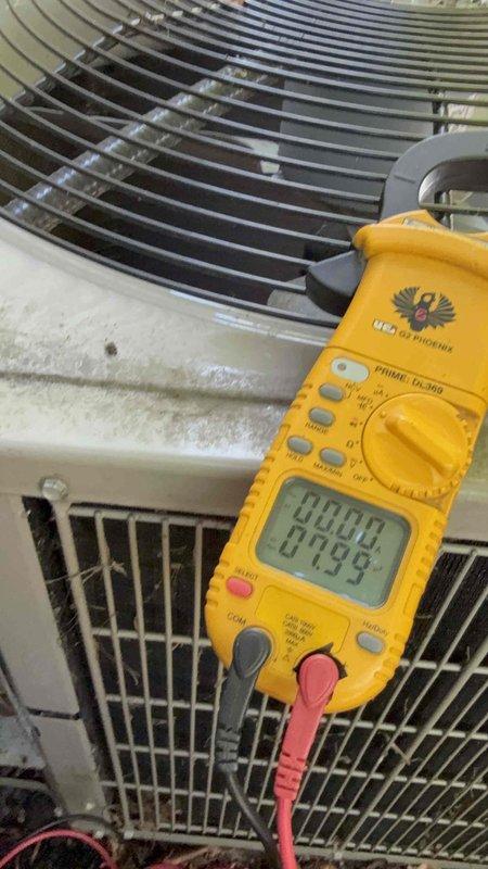 Completed comprehensive Gold AC inspection on 10+ year old residential air conditioning system with air handler located in basement. Performed visual inspection of outdoor condenser unit, which was found to be operational and positioned against building exterior in landscaped area. Conducted electrical diagnostics using digital clamp meter to verify proper amperage draw and system performance. Unit showed normal wear consistent with age, with exterior surfaces displaying minor dirt accumulation. Verified proper airflow through condenser coil fins and fan operation. All refrigerant lines and electrical connections were inspected and found secure. System operating within normal parameters at time of inspection.