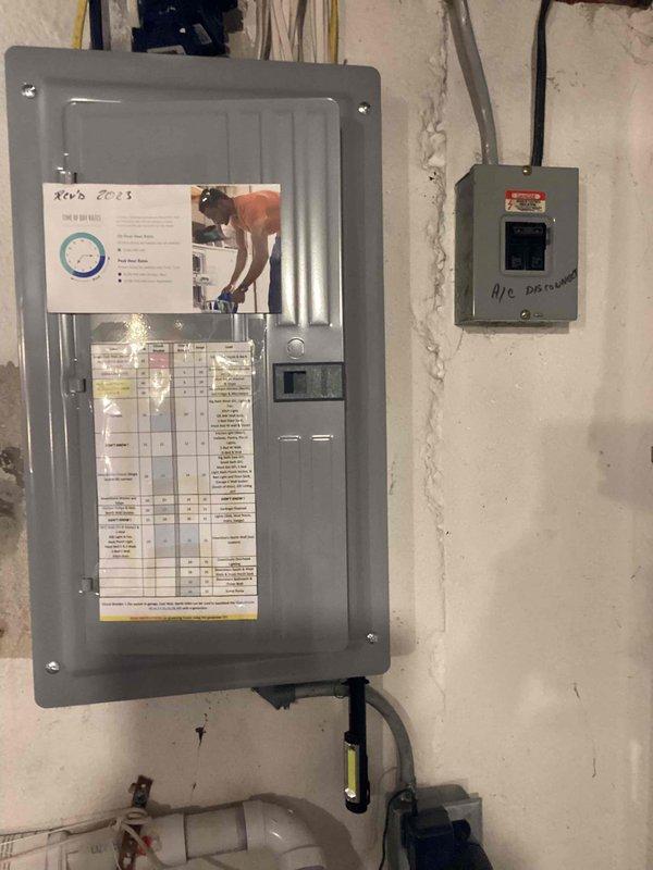 Completed on-site evaluation for backup generator installation with customer preference for Generac or Kohler equipment. Assessed existing electrical service panel, documented current 200-amp main distribution system with A/C disconnect, and surveyed property layout to determine optimal generator placement considering municipal setback requirements and side yard restrictions. Photographed electrical infrastructure and property survey to develop comprehensive installation proposal.
