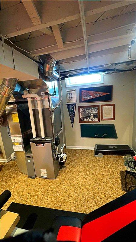 Completed installation of 2.5-ton air conditioning system with matching evaporator coil in basement mechanical room, positioned on left side of existing furnace. Connected new air handler unit to ductwork system, installed condensate drain piping with proper PVC routing, and established all electrical connections. Mechanical permit secured and system reconnected per specifications, with customer enrolled in gold maintenance plan upon satisfactory completion and payment by check.
