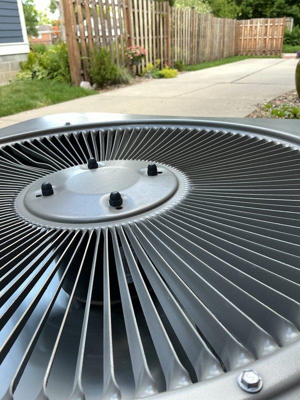 Completed comprehensive Gold AC Tune-Up on 3-year-old outdoor condensing unit per annual maintenance schedule. Performed full system inspection including electrical connections, refrigerant pressures, compressor operation, condenser coil cleaning, and fan motor assessment. Unit operating within manufacturer specifications with no deficiencies noted; all components functioning properly with adequate airflow through clean condenser coil and properly secured fan assembly.