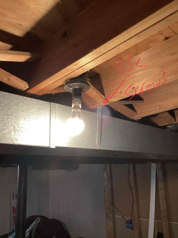 Responded to customer complaint of air conditioning system not cooling properly. Upon inspection, diagnosed low refrigerant charge in R-410A system. Evaluated existing equipment in basement utility area and outdoor unit in backyard to determine system age and condition for replacement estimate. Documented current installation configuration including indoor air handler, refrigerant lines, and electrical connections. Provided comprehensive replacement estimate options based on findings.