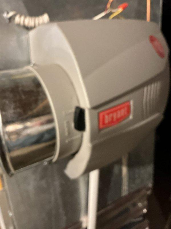 Completed comprehensive Gold AC Inspection on a 5-year-old residential air conditioning system with outdoor condenser unit and basement-located air handler. Performed full system evaluation including visual inspection of condenser unit mounted on exterior pad against brick wall, verified proper refrigerant line connections and electrical disconnect box functionality, and inspected indoor heating and cooling equipment. System found to be operational with no immediate service needs identified at time of inspection.