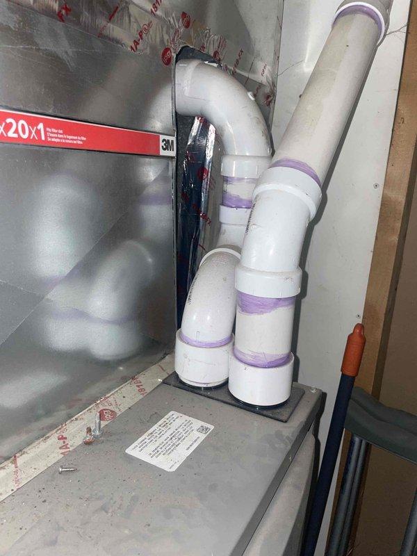 Conducted estimate for replacement of 10+ year old outdoor HVAC unit currently in working condition. Assessed existing natural gas furnace system located in basement utility area with condensate pump, PVC drainage lines, and metal ductwork. Documented current equipment configuration including drain system with purple coupling connections, silver metal supply ductwork with protective insulation, and condensate removal apparatus to provide comprehensive replacement options for aging residential heating and cooling system.