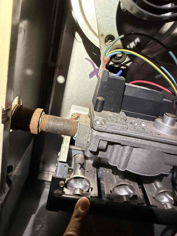 Responded to complaint of loud operation on 20-year-old outdoor air conditioning unit serving upstairs tenant space. Unit was still providing adequate cooling at time of inspection. Performed diagnostic inspection of outdoor condensing unit and associated components. Documented existing conditions including corroded gas line connections and electrical control wiring. Unit's advanced age and component wear noted as contributing factors to noise concerns. Recommended monitoring system performance and planning for future replacement due to equipment age exceeding typical service life expectancy.