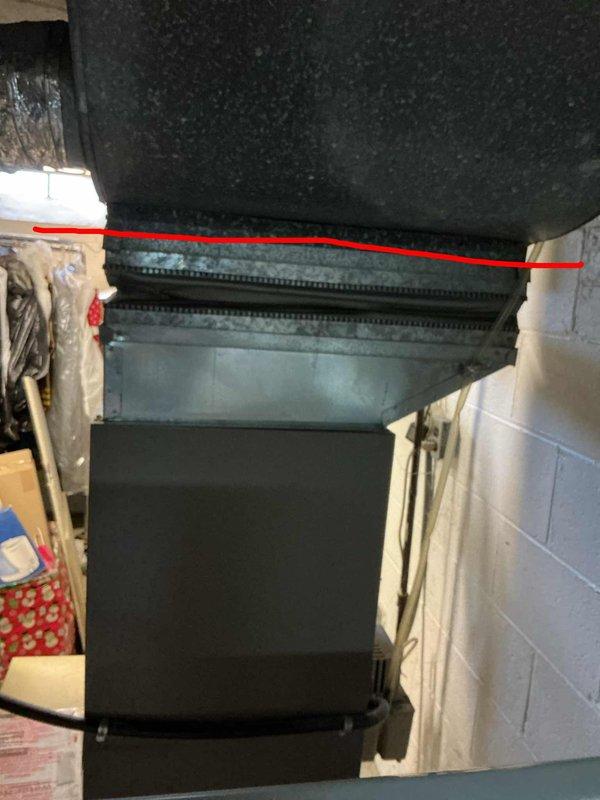 Responded to no airflow complaint with ice buildup on refrigerant lines. Diagnosed 10-year-old AC system with low refrigerant charge causing evaporator coil to freeze. Provided estimate for system replacement due to age and condition of existing equipment, including outdoor condensing unit and basement air handler installation.