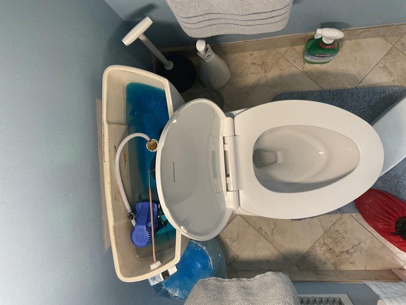 Responded to service call for leaky shower head that had been dripping when shut off for approximately 15 days in a specific bathroom shower. Upon inspection of the chrome shower head mounted in the beige marble-style tiled shower area, diagnosed the issue as a worn internal washer causing water to drip continuously after valve closure. Disassembled the shower head fixture, replaced the deteriorated rubber washer and inspected the shower arm connection for any additional wear or damage. Cleaned mineral deposits from the shower head spray nozzles and internal components to ensure proper water flow and sealing. Reassembled the fixture with proper thread sealant, tested the shower valve operation through multiple on/off cycles, and confirmed no residual dripping occurred. Verified water pressure and spray pattern were functioning normally with no leaks at connection points.