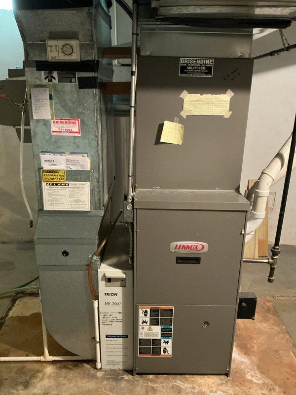 Conducted estimate for furnace replacement on 15-year-old Lennox unit located in basement. Inspected existing HVAC system configuration including air handler, furnace, condensate drainage system, electrical connections, and gas lines. Documented current equipment specifications, manufacturer labels, and installation setup with photographs for replacement proposal development.