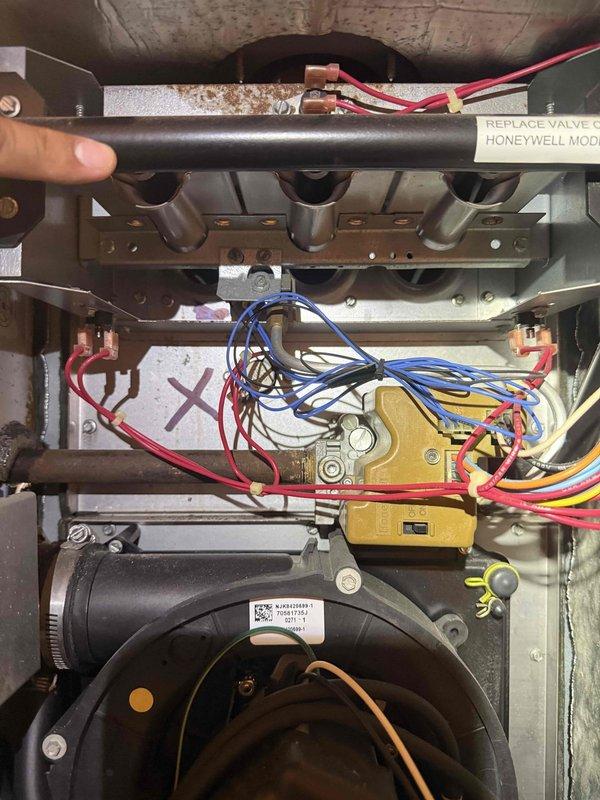 Responded to no cooling complaint on 10-year-old central air conditioning system. Upon arrival, performed diagnostic evaluation of outdoor condenser unit and indoor components. Inspected electrical connections, refrigerant lines, and control systems. Evaluated compressor operation, condenser coil condition, and airflow through unit. Checked indoor air handler components including blower motor, control board wiring, and gas valve connections. Identified system deficiency preventing proper cooling operation. Documented equipment condition with photographs and provided customer with findings and repair recommendations to restore cooling functionality.
