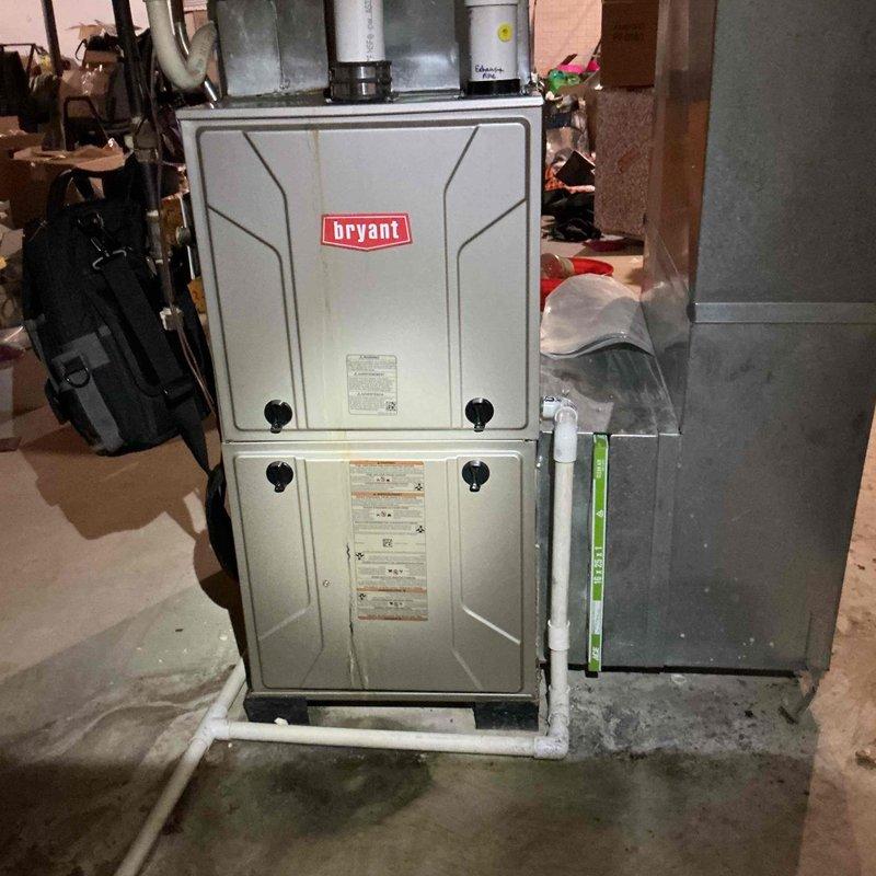 Performed comprehensive furnace inspection on Bryant unit to assess overall condition and determine viability for continued operation versus replacement. Conducted combustion analysis using Bacharach analyzer, recording CO₂ levels at 6.8%, stack temperature at 101°F, ambient air at 70.1°F, excess air at 64.4%, and CO readings at 67 ppm, all within acceptable parameters for natural gas combustion. Verified unit levelness and inspected cabinet condition, ductwork connections, and surrounding installation environment. Included inspection of associated humidifier, thermostat operation, and hot water tank as requested. All systems evaluated and findings documented with diagnostic readings and equipment photos for replacement decision consideration.