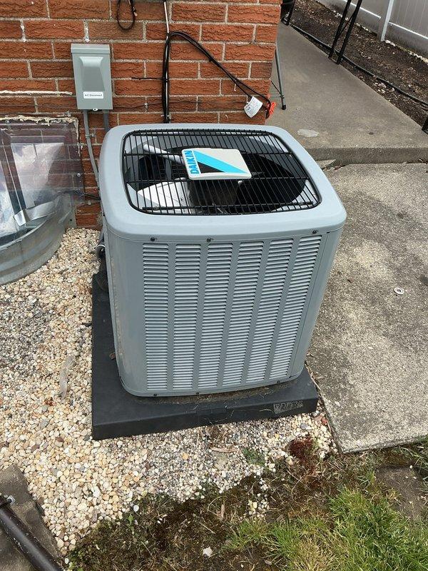 Completed comprehensive Gold Plan AC tune-up and maintenance inspection on 5-year-old Daikin system with warranty valid through April 2027. Performed full system evaluation including condenser unit inspection, electrical connections check, refrigerant level assessment, and airflow verification. System operating properly with no deficiencies noted; unit positioned on proper pad with adequate clearance, disconnect box accessible, and all components functioning within normal parameters.