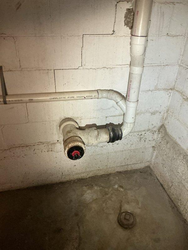 Responded to recurring kitchen sink drainage issue with persistent gurgling noises occurring over five-day period. Previous drain clearing attempts in April provided only temporary relief. Performed main line snaking procedure to clear obstruction and restore proper drainage flow. Inspected plumbing infrastructure in basement area, documenting existing PVC and older metal pipe connections at junction points to assess system condition and identify potential causes of recurring blockage.