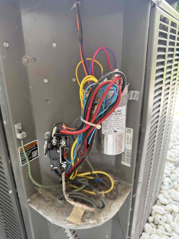 Completed comprehensive Gold AC Inspection on an 8-10 year old residential air conditioning system with outdoor condenser unit and basement air handler. Performed visual inspection of condenser unit exterior, verified proper fan assembly operation, inspected electrical compartment including capacitor and contactor connections, checked all wire terminations and electrical components for signs of wear or damage. Unit found to be in operational condition with all electrical components functioning within normal parameters.