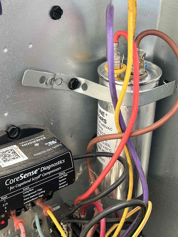 Completed comprehensive Gold AC inspection on 11-year-old single-zone system with air handler located in basement. Performed full system evaluation including electrical component testing of capacitor and CoreSense diagnostic module for Copeland scroll compressor, verified proper operation of all controls, inspected condensate drain piping and PVC discharge lines, and documented equipment condition through photographic records. All equipment found operating within normal parameters with no immediate service needs identified.