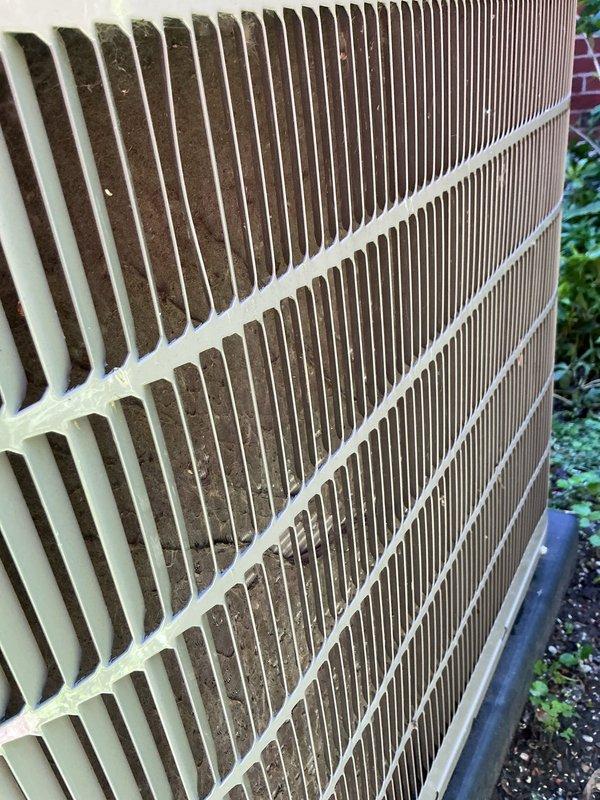 Responded to no cooling complaint on 5-year-old AC system with non-operational outdoor condenser unit. Performed comprehensive leak search using nitrogen pressurization and refrigerant tracing methods to diagnose system failure. Inspected outdoor condenser unit, noting accumulated dirt and debris on heat exchanger coil fins and exterior surfaces consistent with normal outdoor weathering. Unit showed signs of extended outdoor exposure with moderate dust and dirt accumulation affecting airflow efficiency. Conducted systematic pressure testing and leak detection procedures to identify potential refrigerant loss points in condenser assembly and associated refrigerant lines. Equipment remains under manufacturer warranty coverage for qualifying repairs beyond normal wear and tear conditions.