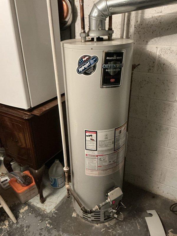 Responded to a non-functional water heater in a 50-year-old residential property. Removed the existing failed unit and installed a new 40-gallon tank-style gas water heater in the basement utility area. Reconnected all water supply lines, gas piping, and exhaust venting with proper galvanized fittings, ensuring compliance with current plumbing codes. Tested all connections for leaks, verified proper burner operation, and confirmed adequate hot water delivery throughout the system.