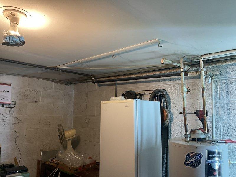 Responded to a non-functional water heater in a 50-year-old residential property. Removed the existing failed unit and installed a new 40-gallon tank-style gas water heater in the basement utility area. Reconnected all water supply lines, gas piping, and exhaust venting with proper galvanized fittings, ensuring compliance with current plumbing codes. Tested all connections for leaks, verified proper burner operation, and confirmed adequate hot water delivery throughout the system.